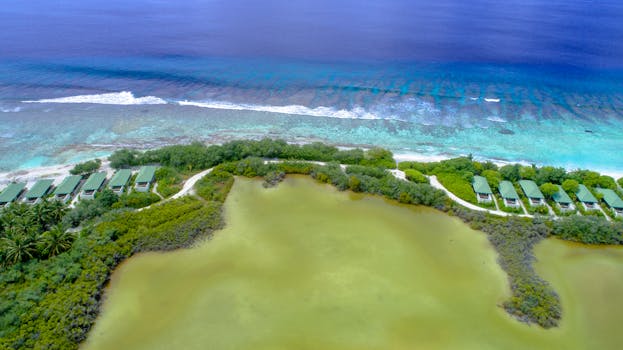 Maldives Villas Built on Twin Reefs With Coral Steps